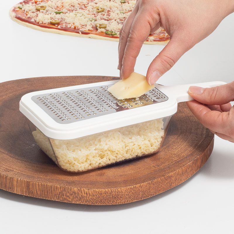 Tárolóval ellátott reszelő